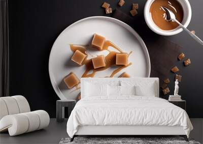 Gourmet Dessert Delight: Top View of Tasty Dulce de Leche Cubes on a White Plate. Generative AI Wall mural