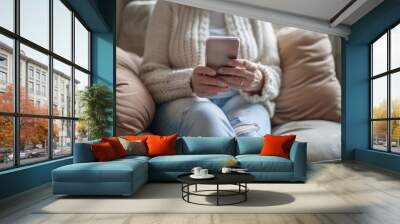 Woman Using Smartphone App at Home - Senior Lady Texting on Cell Phone on Sofa Wall mural