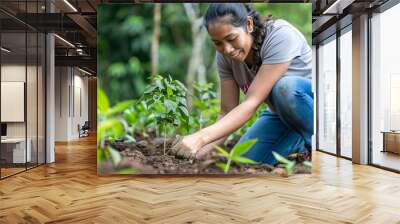 hispanic woman. A woman is planting a tree in a garden, symbolizing environmental conservation and sustainability. Wall mural