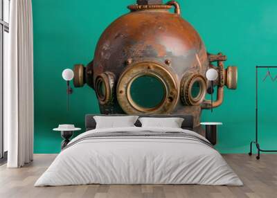 A unique high-tech diving helmet showcases intricate design and weathered metal textures, set against a striking green background. Wall mural