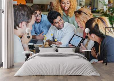 What a stellar team. Shot of a group of business people having a meeting in a cafe. Wall mural