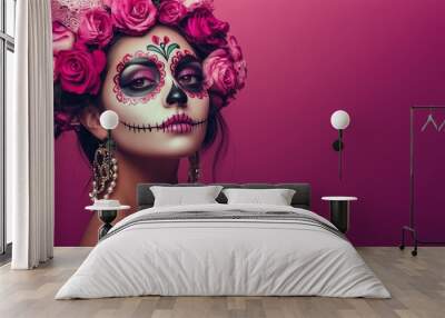 A Mexican woman wearing colorful Day of the Dead makeup on her face on a pink background. Wall mural