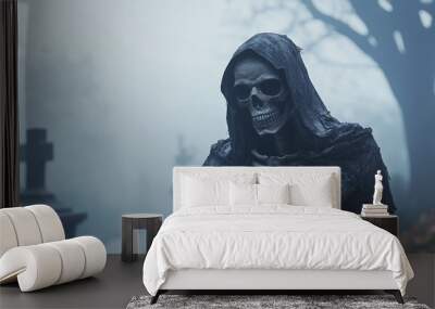 A skeleton in a hood standing in a graveyard on a foggy night. Wall mural