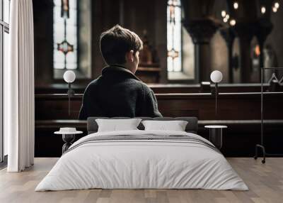 A young boy sitting inside the church, back view. Generative AI. Wall mural