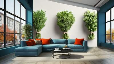 Bundles of fresh herbs including rosemary, parsley, and basil on a light background Wall mural