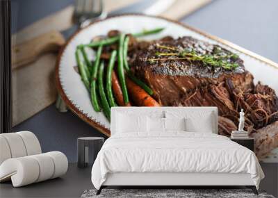 Slow cooked beef roast with carrots and green beans with thyme garnish.  Wall mural