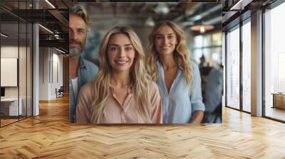 Group of three professionals adults caucasian image. Man and two women with blonde hair photography scene wallpaper. Modern open office space. Business concept photorealistic photo Wall mural