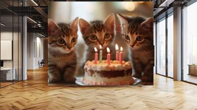 Kittens enjoying a celebration with a birthday cake capturing the essence of joy and festivity Wall mural