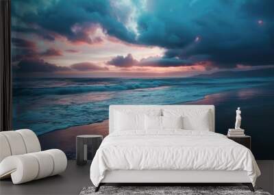 Tranquil beach at dusk with soft waves dark clouds and fading sunlight Wall mural