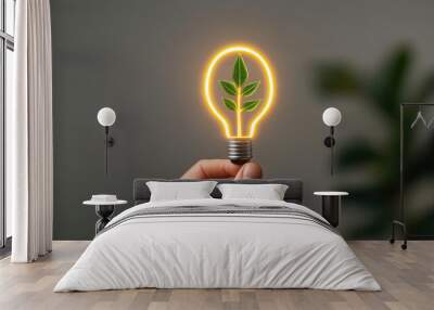 hand holding light bulb with plant inside symbolizes eco friendly ideas and sustainability. This represents innovation and importance of reducing emissions for greener future Wall mural