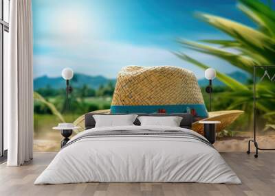 Beach hat with sunglasses with green nature background Wall mural