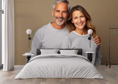 Stylish Middle-Aged Couple in Grey Sweatshirts Wall mural