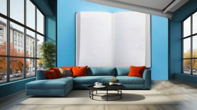 mock up of blank white open book on a blue background  Wall mural