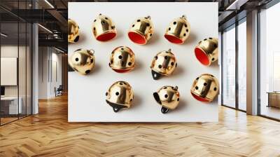 A set of neatly arranged jingle bells on a plain white surface  Wall mural