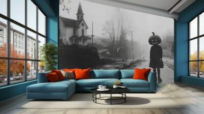 black and white horror photo of a little girl wearing a jack-o'-lantern mask standing in a foggy town street with a black cat, church in the background. Wall mural