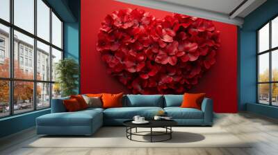 A heart made of red flowers is on a red background. The heart is surrounded by a large number of red flowers, creating a beautiful and romantic scene.  Wall mural