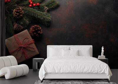 Christmas background with red and dark brown colors on an old texture, leaving space for text. Flat lay of a top view of Christmas decorations, including a present box on a textured surface.  Wall mural