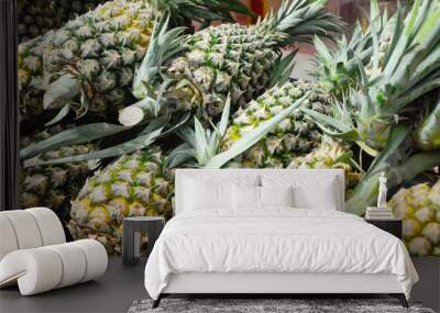 Pile pineapple fruit which has been harvested and display for sale.  Wall mural