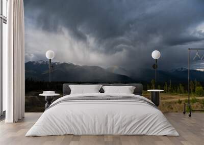 Beautiful summer storm over the rocky mountains with Rainbow Wall mural