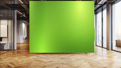 Green foil metallic wall with glowing shiny light, abstract texture background Wall mural