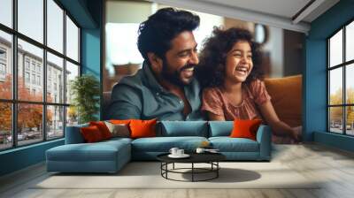 Loving young father of Indian ethnicity and little daughter having a fun time at home Wall mural