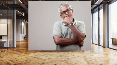 Mature man of Indian ethnicity with a thoughtful expression Wall mural