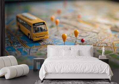 Miniature city map with bus and colorful map pins, representing urban navigation and travel routes. Wall mural