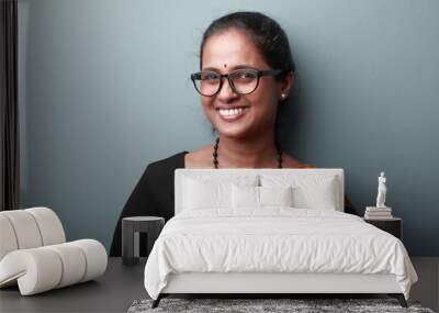 Portrait of a happy smiling woman of Indian origin wearing traditional dress Sari Wall mural