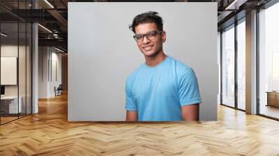 Portrait of a happy young man of Indian origin Wall mural