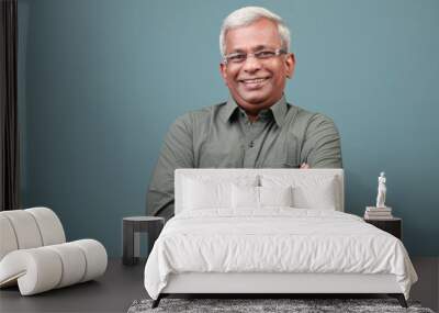 Portrait of a smiling man of Indian ethnicity  Wall mural