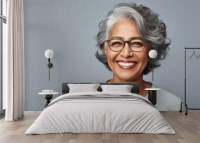 Portrait of a smiling senior woman of  Indian ethnicity Wall mural