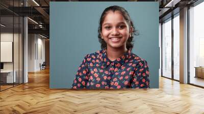 Portrait of a smiling young girl of Indian ethnicity Wall mural