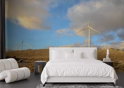 Wind farm on the mountain at sunset. Wind turbines on the hill. Renewable energy. Wind park. Wall mural