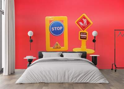 miniature stop signs and do not enter signs isolated on a red background Wall mural