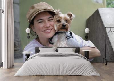 Beautiful young woman spending time with her doggy Wall mural