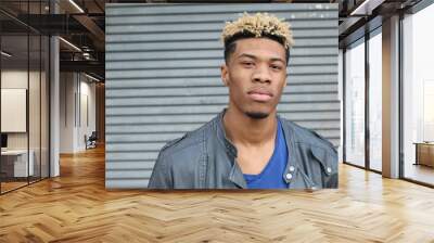 Close-up of handsome young, dark-skinned man with copy space Wall mural