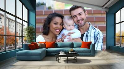 happy interracial family is celebrating, laughing and having fun with hispanic african american moth Wall mural