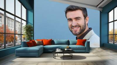 headshot smiling modern man, creative professional isolated on blue wall background Wall mural