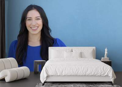 Portrait of a young girl smiling with copy space  Wall mural