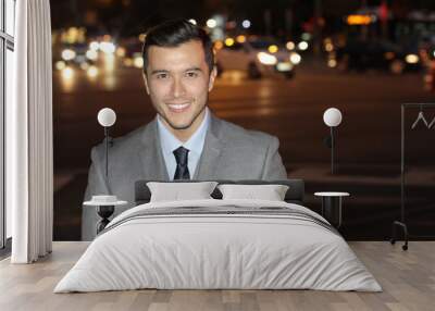 Professional young ethnic isolated in the city at night with copy space Wall mural