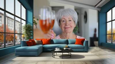 Senior woman making a toast  Wall mural