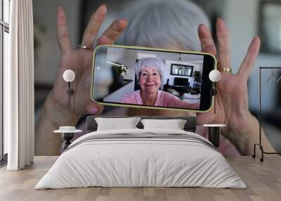 Senior woman taking a selfie at home  Wall mural