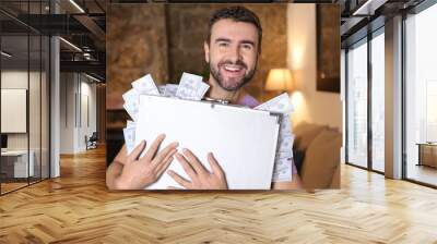 Wealthy young man with full briefcase
 Wall mural