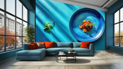 A dramatic overhead shot of porzo on a vibrant blue plate, with bold contrasting colors and crisp shadows to create a sense of energy and movement. Wall mural