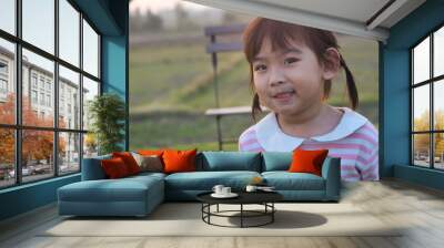 Portrait Asian cute Kid girl smiling happy Wall mural