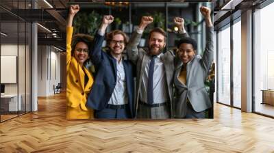 Diverse group of professional young business people standing together with raised arms in a fist at office, Generative AI Wall mural