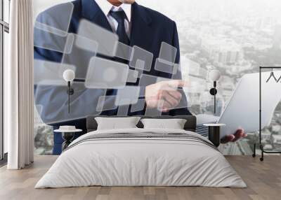 Double exposure of business man pushing on graphic icon with laptop Wall mural