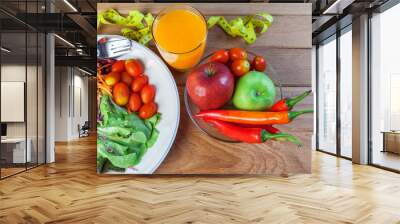 Fresh healthy salad with different fruits and vegetables on wooden background Wall mural