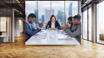 Team of diversity business people praying together before the meeting for asking god's favor for better future during economics recession crisis for hopeful belief and religions business concept Wall mural