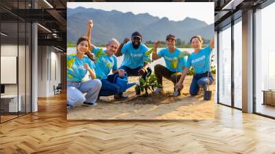 Team of young and diversity volunteer worker group enjoy charitable social work outdoor in tree forest planting NGO work for fighting climate change and global warming in the coastline habitat project Wall mural